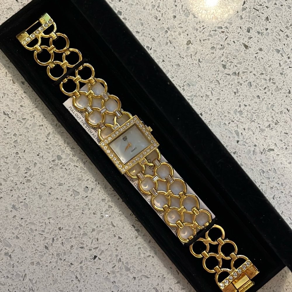Gold bracelet watch with rhinestones